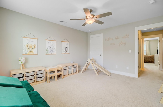playroom with baseboards, ceiling fan, carpet flooring, and visible vents