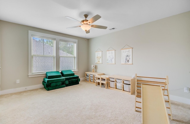 game room featuring a ceiling fan, baseboards, visible vents, and carpet floors