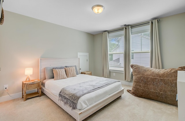 bedroom featuring carpet, visible vents, and baseboards