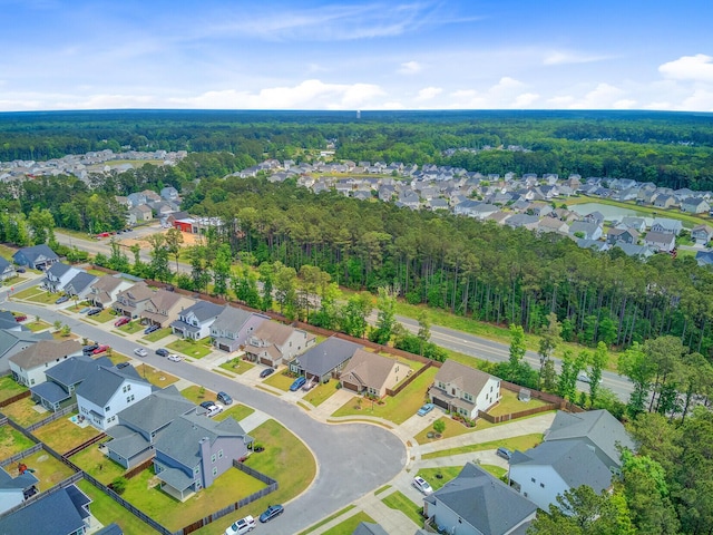 bird's eye view with a forest view and a residential view