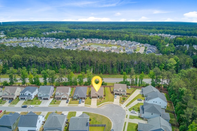 aerial view with a forest view and a residential view