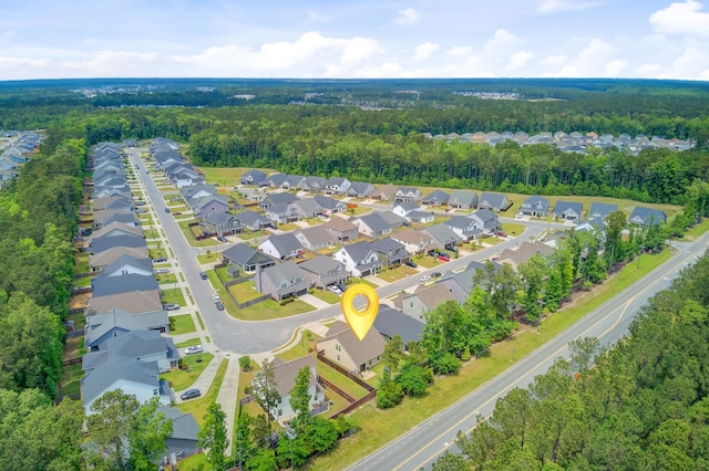 bird's eye view with a forest view and a residential view