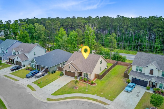 bird's eye view with a forest view and a residential view