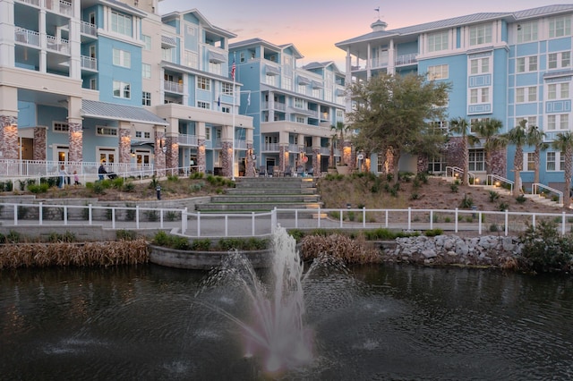 surrounding community featuring a water view