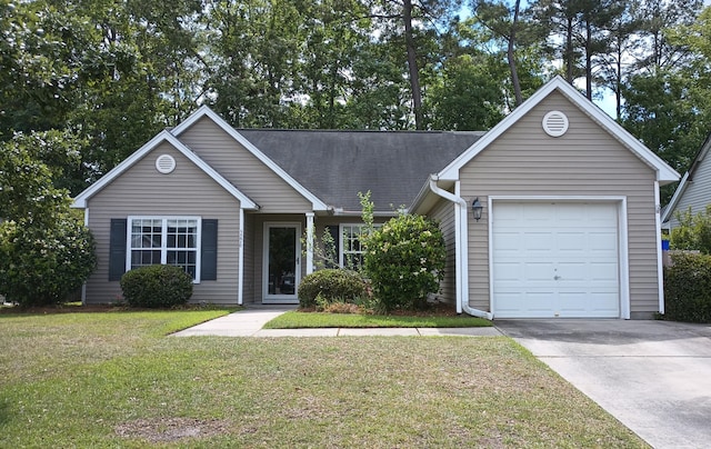 ranch-style home featuring a garage, a shingled roof, a front yard, and concrete driveway