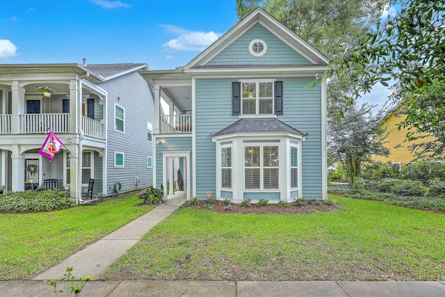3152 Riverine, Charleston, SC 29414 - view of front of house with a front yard and a balcony