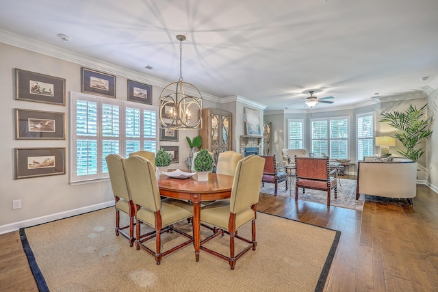 3152 Riverine, Charleston, SC 29414 - dining room with ornamental molding, healthy amount of natural light, hardwood / wood-style flooring, a chandelier, and a fireplace