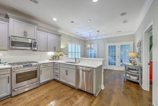3152 Riverine, Charleston, SC 29414 - kitchen featuring stainless steel appliances, a sink, gray cabinets, a peninsula, and dark wood-type flooring