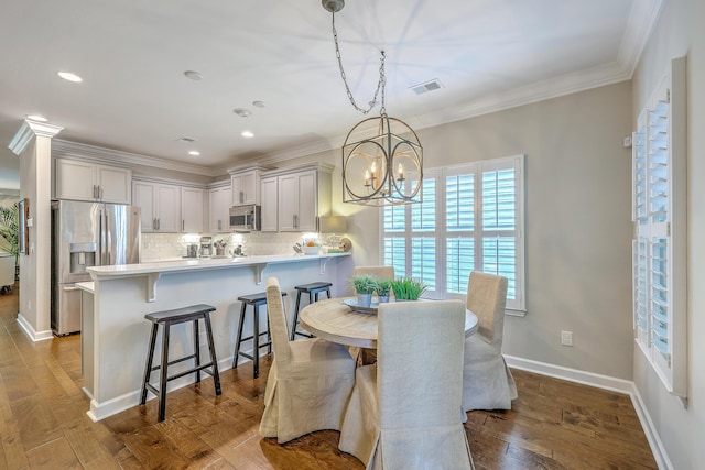 3152 Riverine, Charleston, SC 29414 - dining space with a chandelier, dark wood finished floors, ornamental molding, recessed lighting, and baseboards