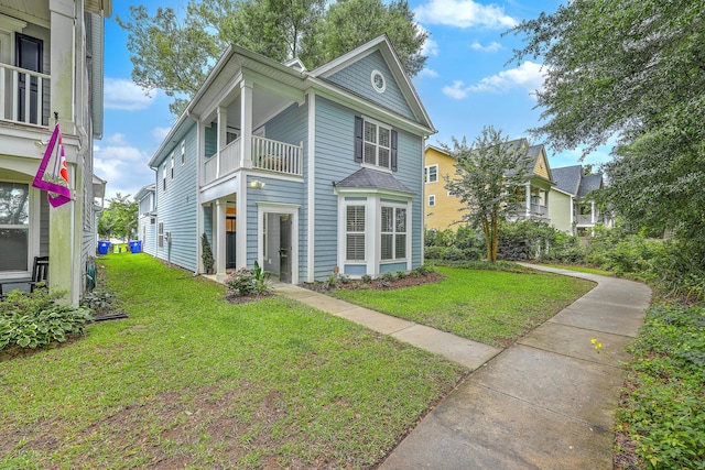 3152 Riverine, Charleston, SC 29414 - view of front of property with a balcony and a front lawn