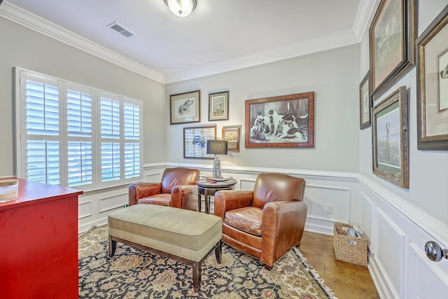 3152 Riverine, Charleston, SC 29414 - living area with crown molding, a decorative wall, wood finished floors, and a wainscoted wall