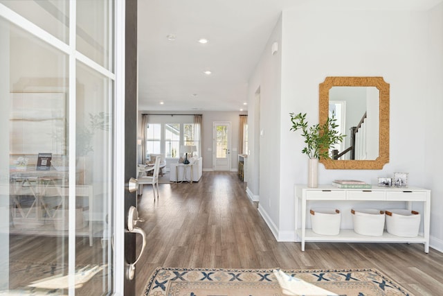 entryway featuring recessed lighting, stairway, baseboards, and wood finished floors