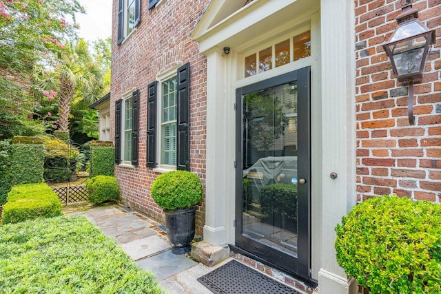 entrance to property with brick siding