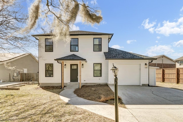 view of front of house with an attached garage, a shingled roof, fence, and concrete driveway