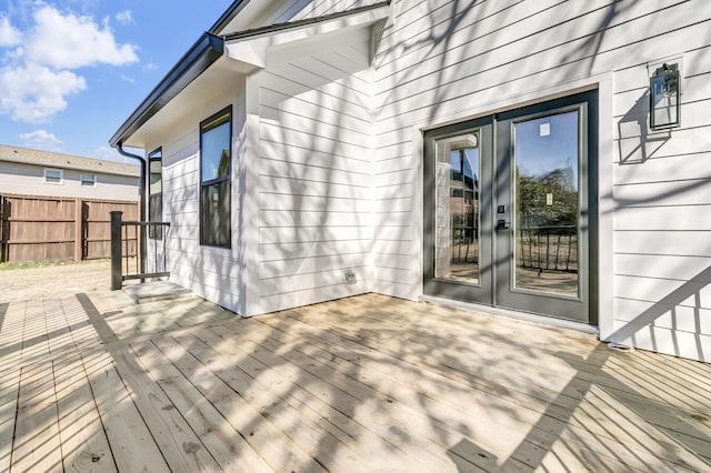 wooden deck with fence and french doors