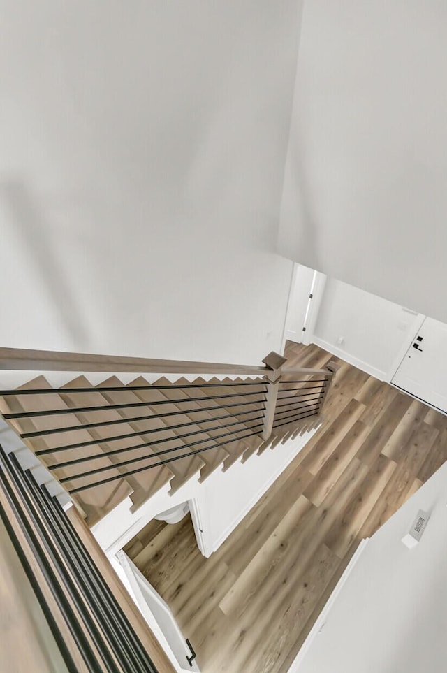 staircase featuring wood finished floors