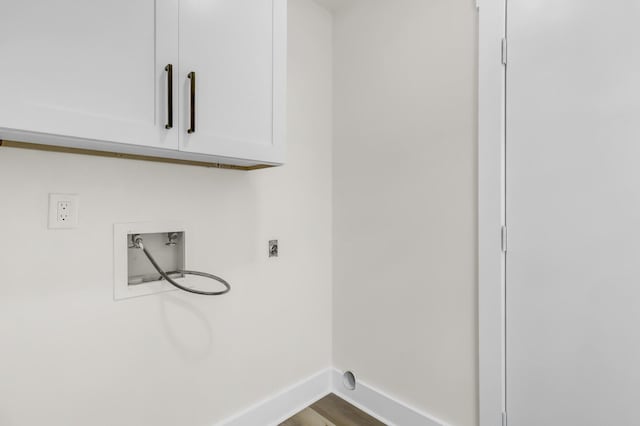 laundry area featuring cabinet space, baseboards, dark wood-style floors, hookup for an electric dryer, and washer hookup