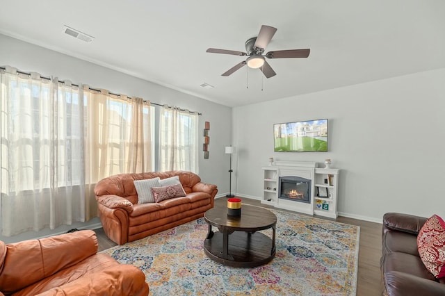 living room with hardwood / wood-style flooring and ceiling fan