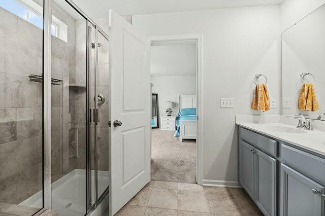 bathroom with a shower with door and vanity