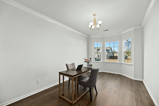 dining area featuring an inviting chandelier, crown molding, and dark hardwood / wood-style flooring