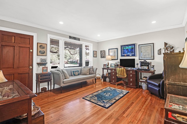 living room featuring wood-type flooring and crown molding