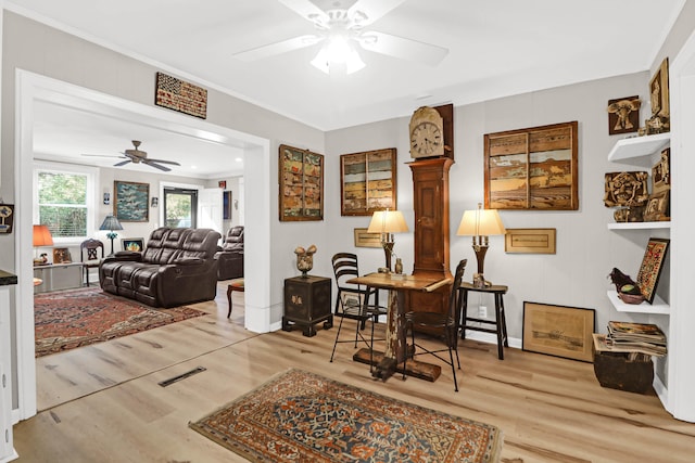 office space with ornamental molding, hardwood / wood-style floors, and ceiling fan