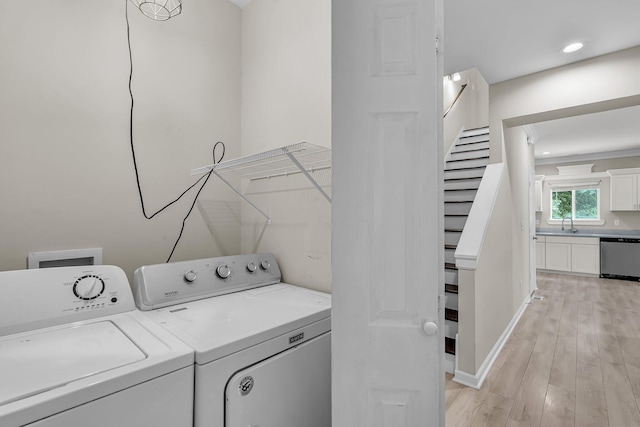 62 Wexford Way, Walterboro, SC 29488 - laundry area with separate washer and dryer, light wood-type flooring, and baseboards