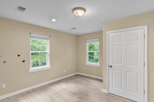 62 Wexford Way, Walterboro, SC 29488 - unfurnished bedroom featuring multiple windows, light wood-style floors, and baseboards