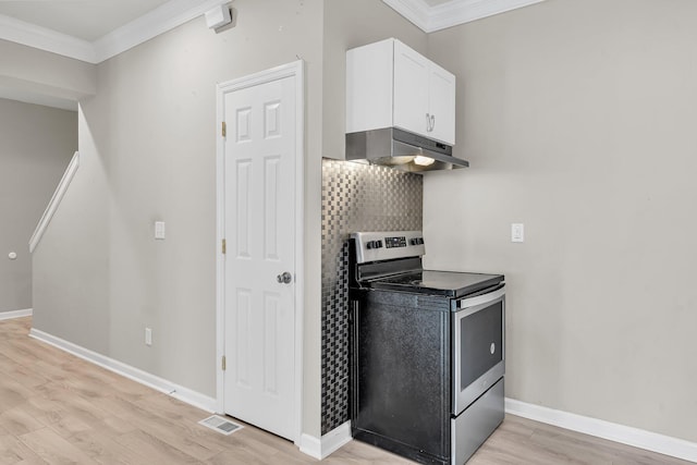 62 Wexford Way, Walterboro, SC 29488 - kitchen with electric stove, under cabinet range hood, crown molding, white cabinetry, and light wood finished floors