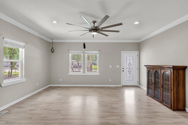 62 Wexford Way, Walterboro, SC 29488 - unfurnished living room with ornamental molding, healthy amount of natural light, ceiling fan, light wood finished floors, and baseboards