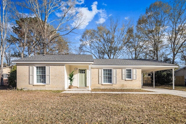 ranch-style home with a front lawn and a carport