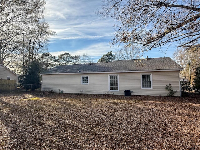 rear view of house featuring central AC