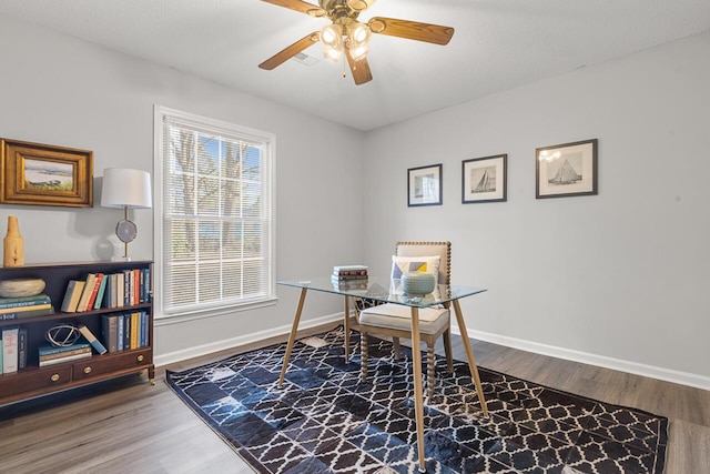 home office with ceiling fan and wood-type flooring