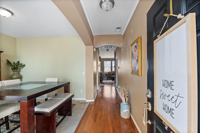 hall with hardwood / wood-style floors