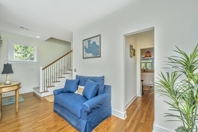 living area with hardwood / wood-style floors