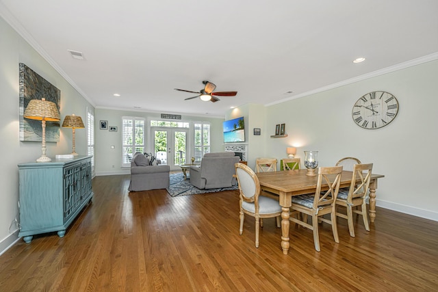 dining area with ceiling fan, crown molding, wood-type flooring, and french doors