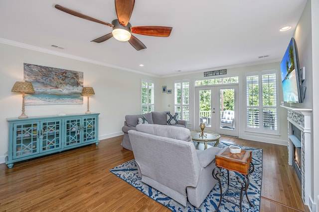 living room featuring french doors, dark hardwood / wood-style floors, ceiling fan, and ornamental molding