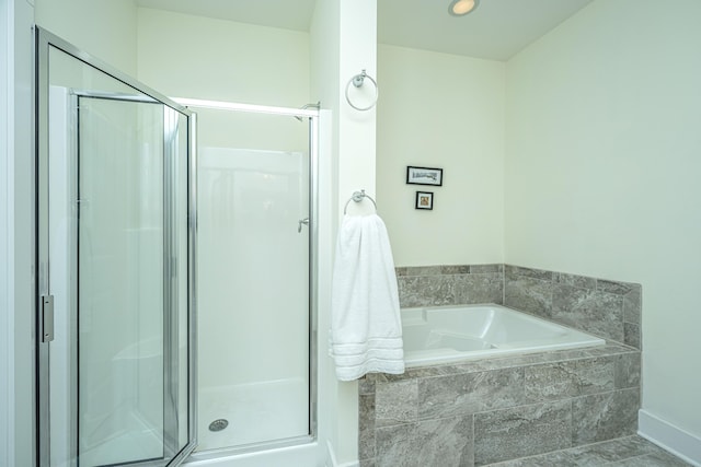 bathroom with independent shower and bath