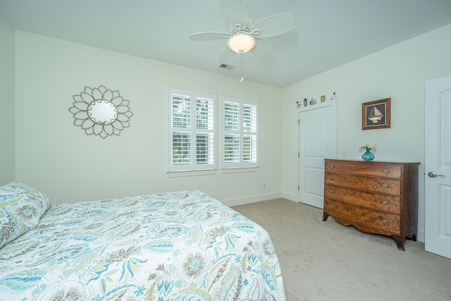 carpeted bedroom featuring ceiling fan