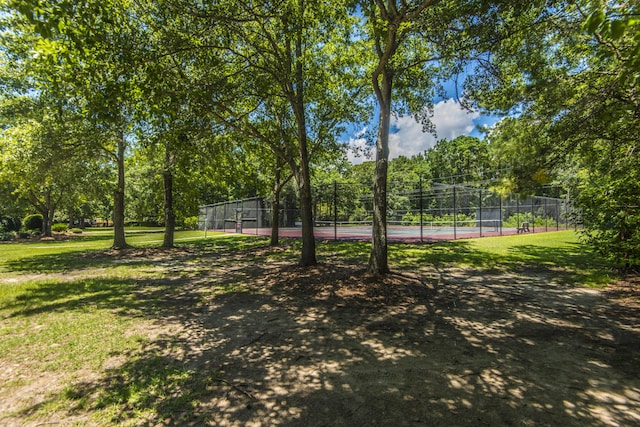 exterior space with tennis court