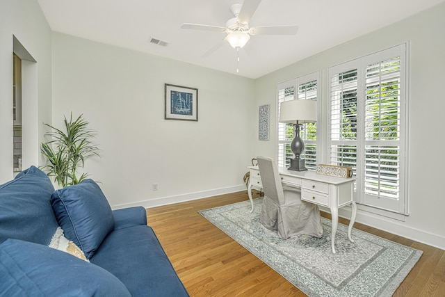 home office with ceiling fan and wood-type flooring