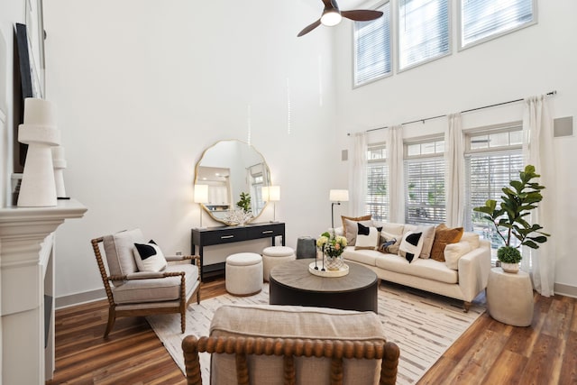 living room with hardwood / wood-style floors, a healthy amount of sunlight, and ceiling fan