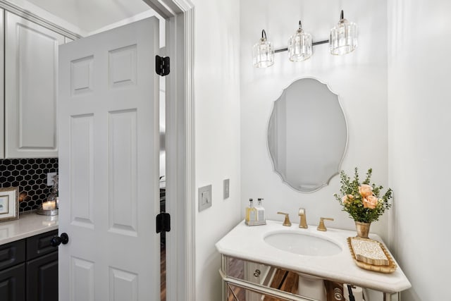 bathroom with vanity and backsplash