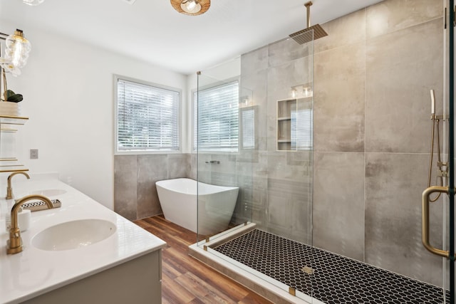 bathroom featuring vanity, hardwood / wood-style flooring, and independent shower and bath