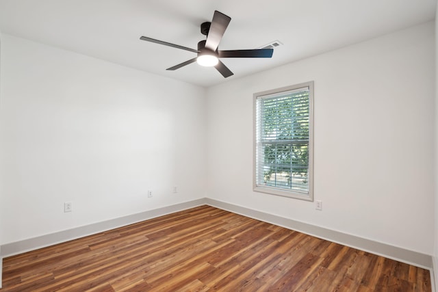 empty room featuring hardwood / wood-style floors and ceiling fan