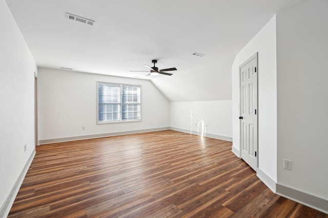 bonus room featuring vaulted ceiling, dark hardwood / wood-style floors, and ceiling fan