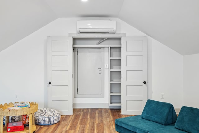 closet featuring a wall mounted air conditioner