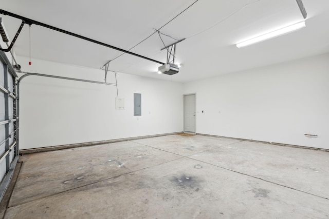 garage featuring a garage door opener and electric panel