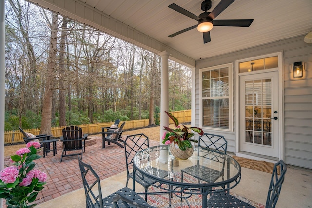 sunroom / solarium with ceiling fan