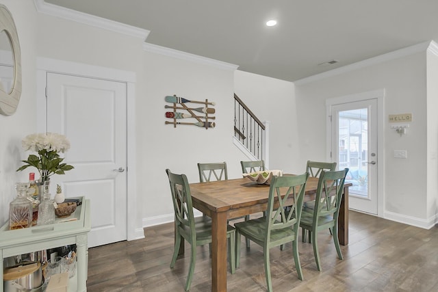 dining space with stairs, baseboards, wood finished floors, and crown molding